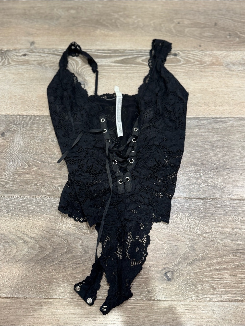 Free People lace bodysuit features a distinct lace-up front detail 1193